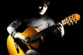 Guitar player guitarist in darkness Royalty Free Stock Photo