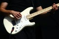 Guitar player hands with electric stratocaster type guitar