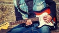 Guitar player playing in the street Royalty Free Stock Photo