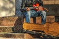 Guitar player playing on the street Royalty Free Stock Photo