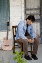 Guitar player on porch Royalty Free Stock Photo