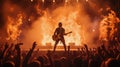 Guitarist on stage with pyrotechnics at rock concert, view from crowd Royalty Free Stock Photo