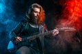 Guitar player. Rockstar bearded man plays on guitar isolated on smoke background. Studio shot Royalty Free Stock Photo