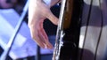 Guitar playing. Guitarist. Man hand and six-string electrical guitar. Close-up of guitarist with guitar Royalty Free Stock Photo