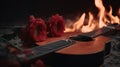 a guitar with a red flower on it next to a flame