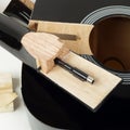 Guitar repair and service - Closeup fragment broken guitar Royalty Free Stock Photo