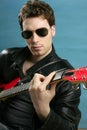 Guitar rock star man sunglasses leather jacket Royalty Free Stock Photo