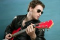 Guitar rock star man sunglasses leather jacket Royalty Free Stock Photo