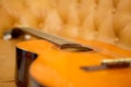 Classic Guitar In The Sofa Royalty Free Stock Photo