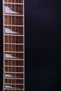 Guitar stringsand fretboard, close up. Electric guitar. .Soft selective focus. On black background