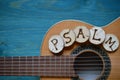 Guitar on teal wood with the word: PSALM Royalty Free Stock Photo