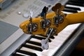 Guitar and upright electro-piano Royalty Free Stock Photo