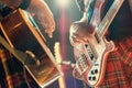 Guitarist and bassist pop musicians during a group performance Royalty Free Stock Photo