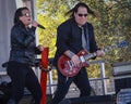 Guitarist Dallan Baumgarten and singer Jessica Jackson from the local rock band Rock Lobster performs at Parada Del Sol parade