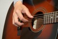 Guitarist hand, fingers playing acoustic guitar Royalty Free Stock Photo