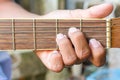 Guitarist hand playing acoustic guitar Royalty Free Stock Photo