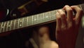 Guitarist hand playing guitar in studio. Unrecognizable man rehearsing indoor. Royalty Free Stock Photo