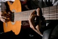 Guitarist hands and guitar close up. Playing classic guitar. Play the guitar Royalty Free Stock Photo