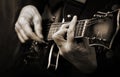 Guitarist hands and guitar close up. playing electric guitar. copy spaces. black and white. Royalty Free Stock Photo