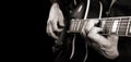 Guitarist hands and guitar close up. playing electric guitar. copy spaces. black and white. Royalty Free Stock Photo