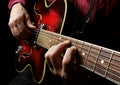 Guitarist hands and guitar close up. playing electric guitar. copy spaces.  black and white. Royalty Free Stock Photo