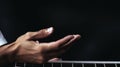 Guitarist hands playing acoustic guitar on black background, closeup Generative AI