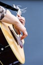 Guitarist hands playing acoustic guitar closeup Royalty Free Stock Photo