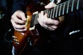 Guitarist hands plays guitar solo, close-up. A singer man playing guitar