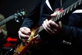 Guitarist hands plays guitar solo, close-up. A singer man playing guitar