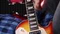 Guitarist learning new accords on electric guitar, close up. Vertical video