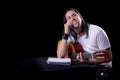 Guitarist musician writing a song on his guitar