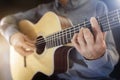 Guitarist playing an acoustic classical guitar Royalty Free Stock Photo