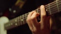 Guitarist playing acoustic guitar in studio. Musician rehearsing indoor. Royalty Free Stock Photo