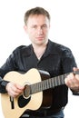 Guitarist playing acoustic six-string guitar