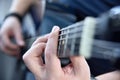 Guitarist playing on blue acoustic guitar Royalty Free Stock Photo