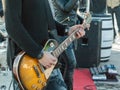 Guitarist playing electrical guitar on a concert