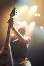 A guitarist playing his heart out beneath the strobe lights. This concert was created for the sole purpose of this photo