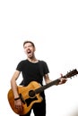 Guitarist playing and singing loudly on isolated a white background Royalty Free Stock Photo