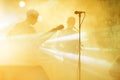 Guitarist silhouette perform on a concert stage. Abstract musical background. Music band with guitar player. Playing Royalty Free Stock Photo