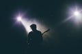 Guitarist silhouette on a stage Royalty Free Stock Photo