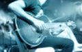 Guitarist on stage, blue tone soft and blur for background Royalty Free Stock Photo