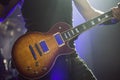 Guitarist on stage, guitar closeup Royalty Free Stock Photo