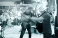 Guitarist on street walk at night, blue tone and motion blur concept Royalty Free Stock Photo