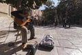 Guitarist under a tree