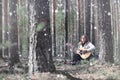 Guitarist in the woods at a picnic. A musician with an acoustic