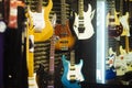 Guitars of different colours in music store Royalty Free Stock Photo