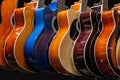 A Guitars hanging in a row on the wall Royalty Free Stock Photo