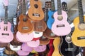 Guitars for sale hanging from the ceiling inside the store. Royalty Free Stock Photo