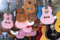 Guitars for sale hanging from the ceiling inside the store. Royalty Free Stock Photo