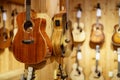 Guitars for sale hanging on a wall at a music store Royalty Free Stock Photo